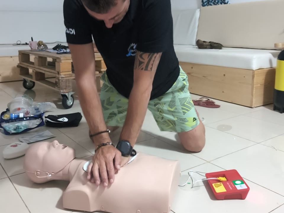 CPR with AED pads on the training manikin