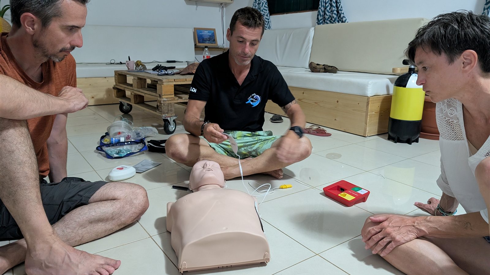 AED and CPR practice with training manikin during PADI Rescue Diver course